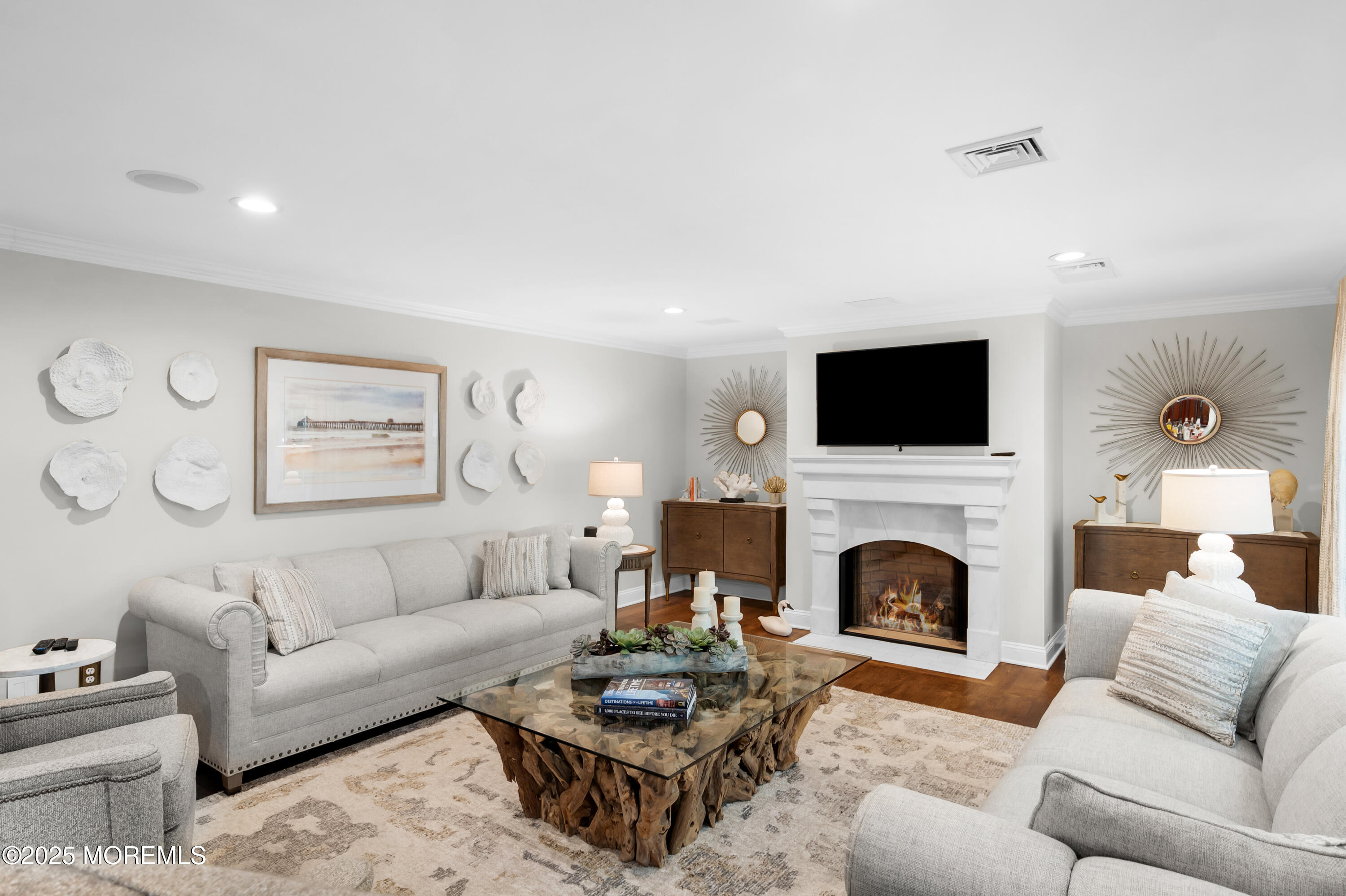 24 Princeton Street Red Bank, NJ 07701 - Photo 7 of 37 a living room with furniture flat screen tv and a fireplace