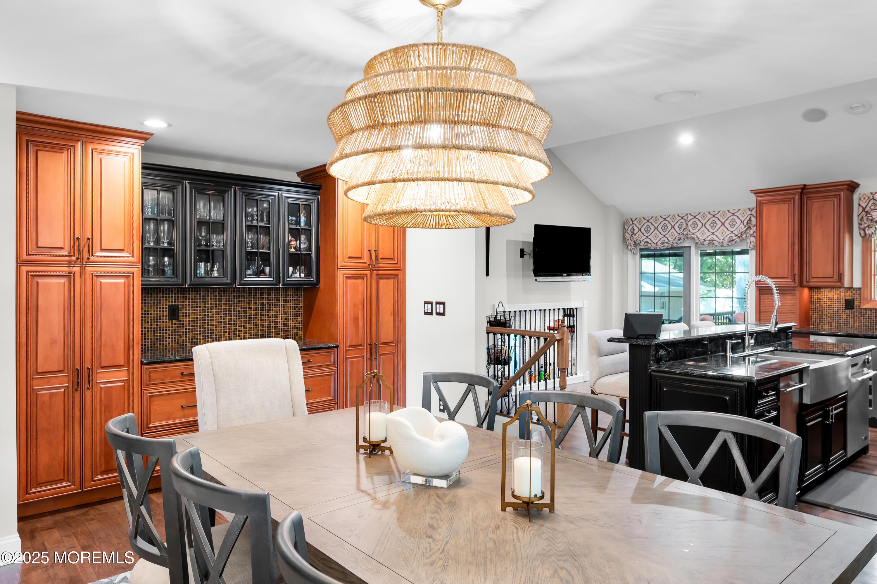24 Princeton Street Red Bank, NJ 07701 - Photo 10 of 37 a living room with furniture a flat screen tv and a large window