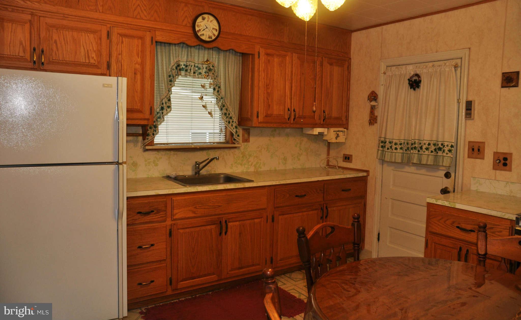 1807 Middleborough Road Baltimore, MD 21221 - Photo 3 of 12 a bathroom with a sink a mirror and a shower