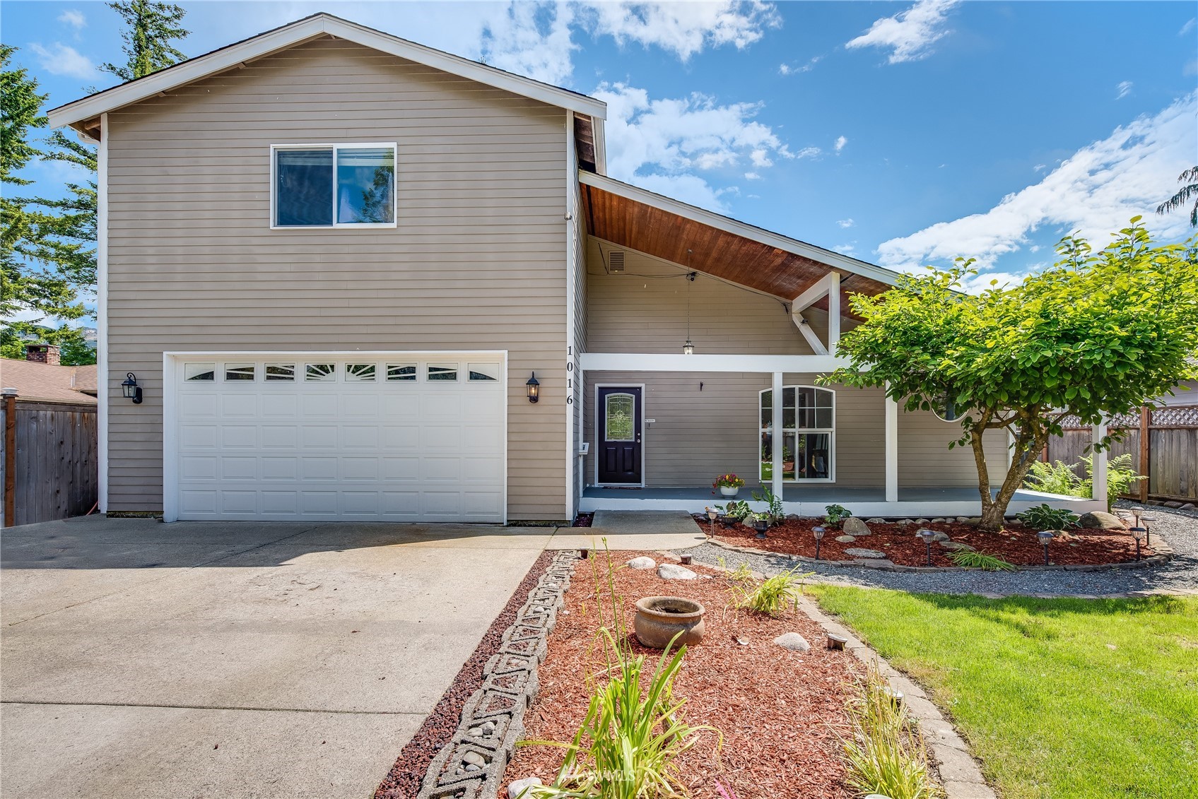 1016 Dyer Road Sultan, WA 98294 - Photo 3 of 39 a front view of a house with a yard