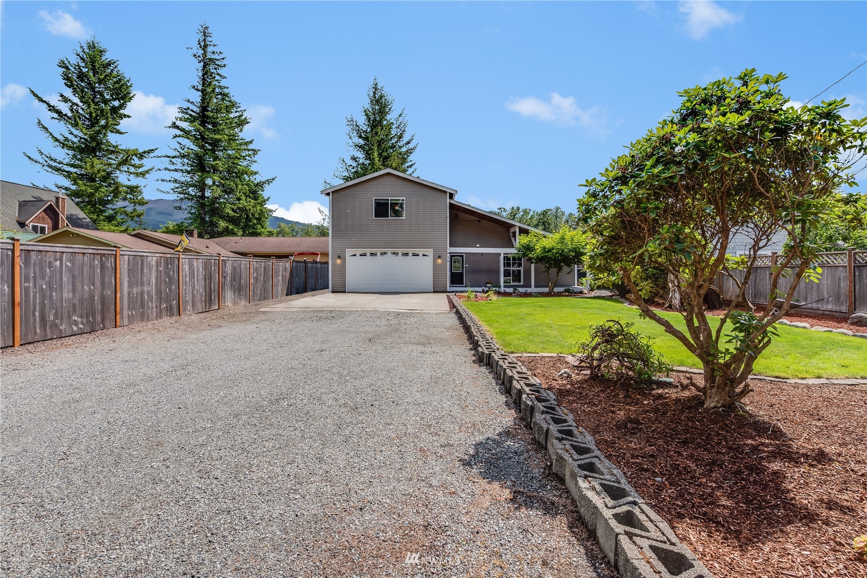 1016 Dyer Road Sultan, WA 98294 - Photo 34 of 39 a view of a house with a yard