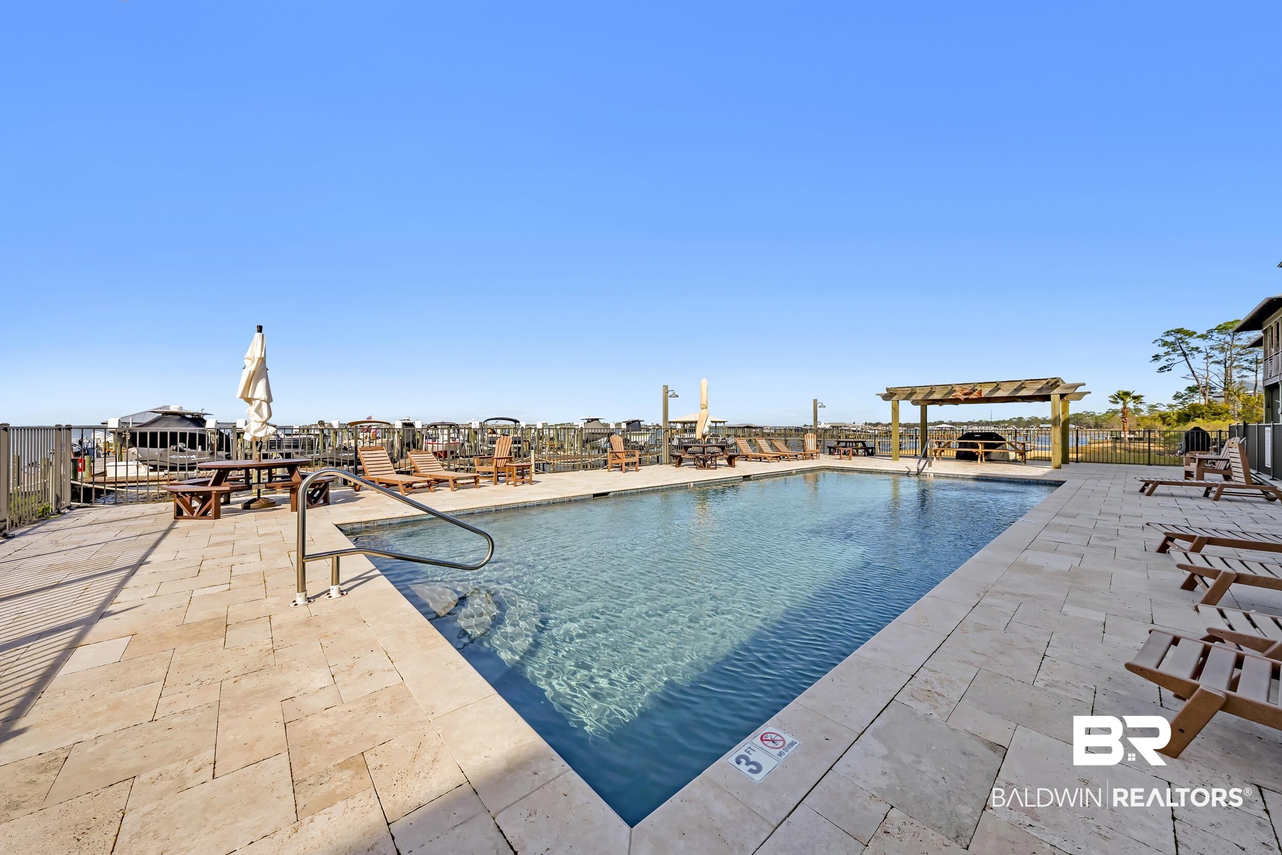 25773 Canal Road, Unit 32 Orange Beach, AL 36561 - Photo 28 of 35 Community pool with a patio area