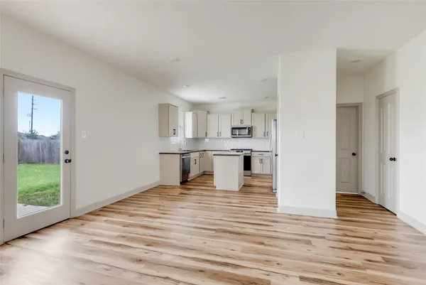 a view of kitchen with wooden floor
