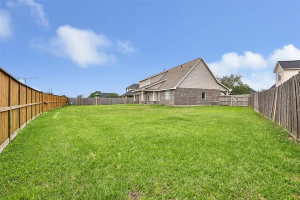a house view with swimming pool in front of it