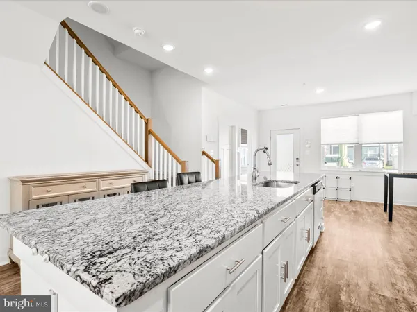 a living room with granite countertop living room and hallway