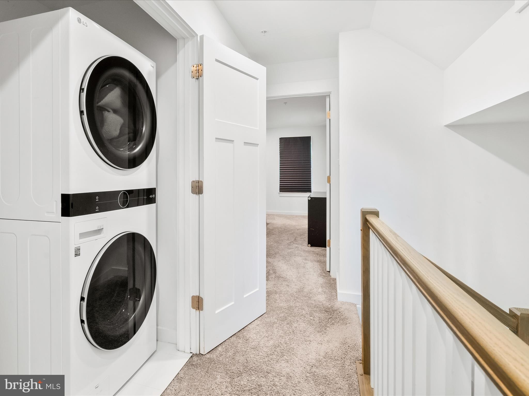 404 Waverley Drive Frederick, MD 21702 - Photo 13 of 28 a view of a hallway with washer and dryer