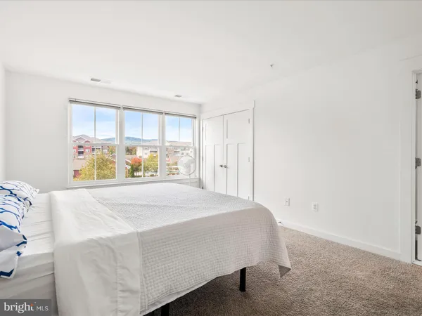 a room with a bed and a window