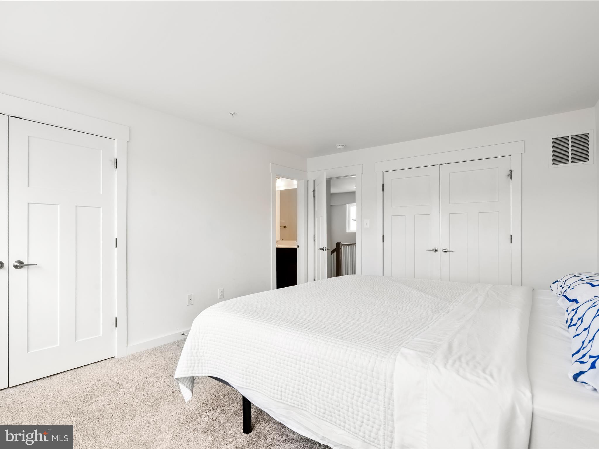 404 Waverley Drive Frederick, MD 21702 - Photo 23 of 28 a spacious bedroom with a bed and a cabinets