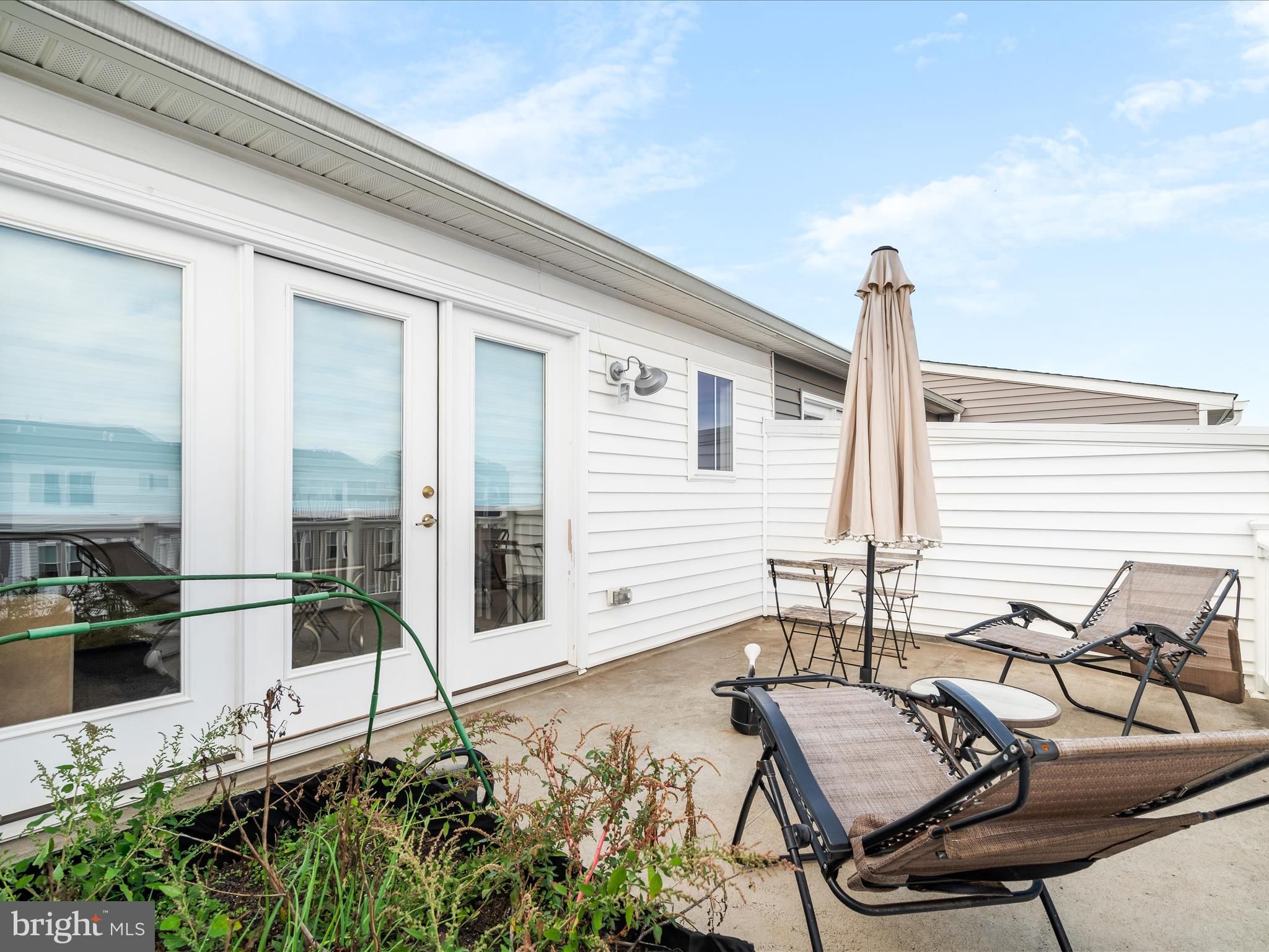404 Waverley Drive Frederick, MD 21702 - Photo 25 of 28 a view of a chairs and table in the balcony