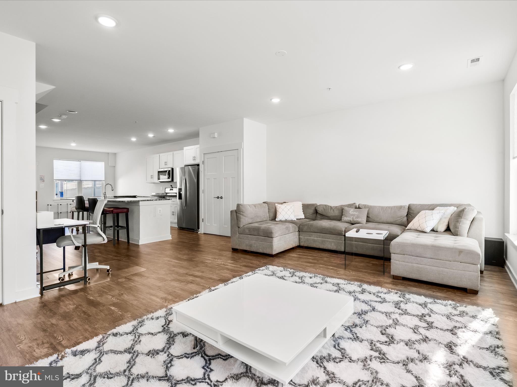 404 Waverley Drive Frederick, MD 21702 - Photo 5 of 28 a living room with furniture and kitchen view
