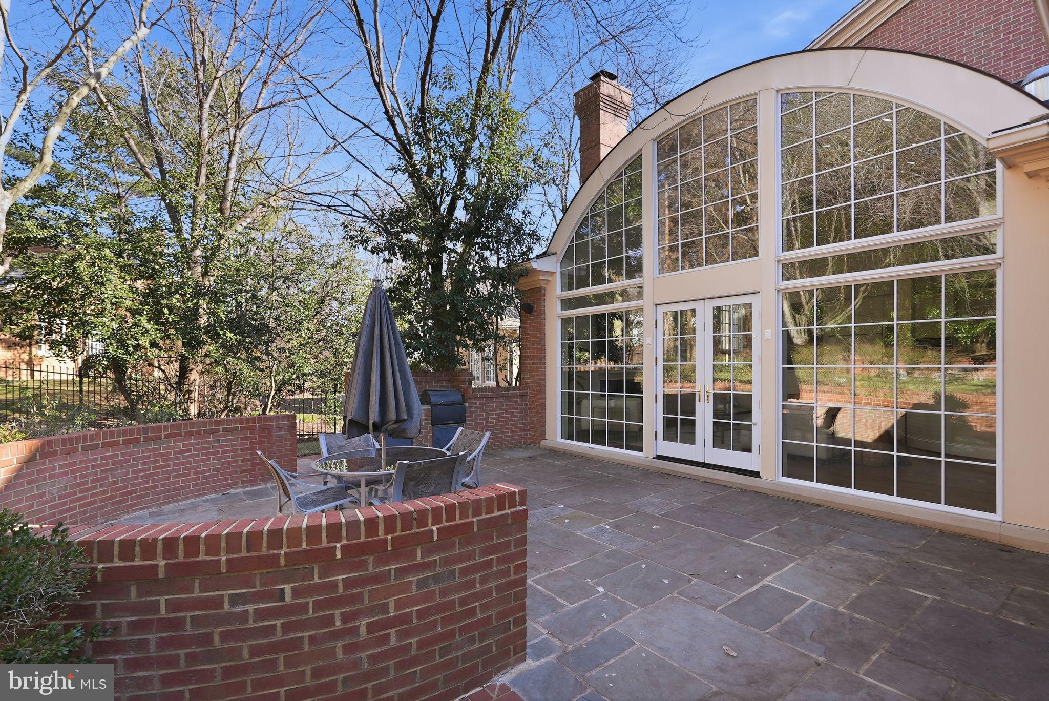 10033 Chartwell Manor Court Potomac, MD 20854 - Photo 2 of 4 a front view of a house with a garden