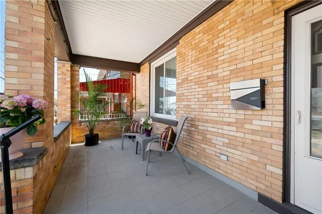 a backyard of a house with outdoor seating