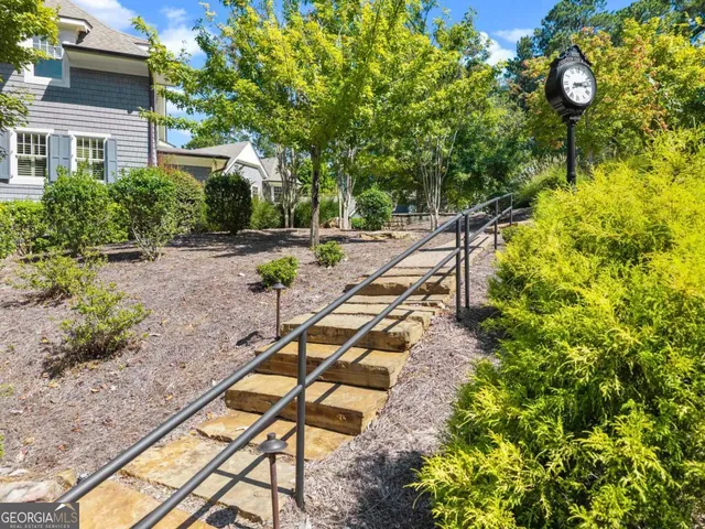 a view of a pathway with a yard