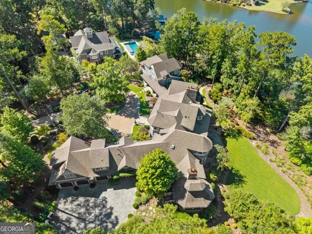 an aerial view of a house with a yard and garden