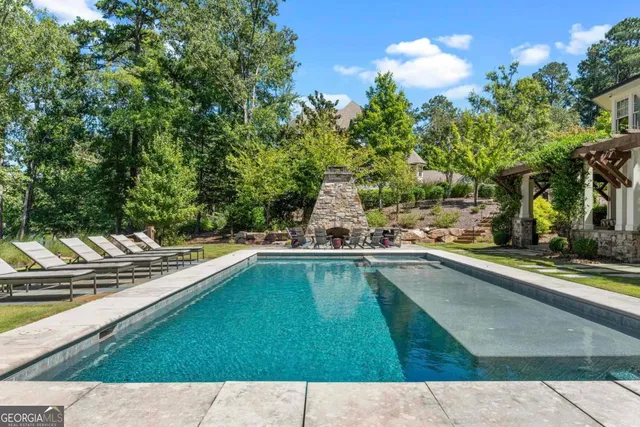 a view of swimming pool with chairs