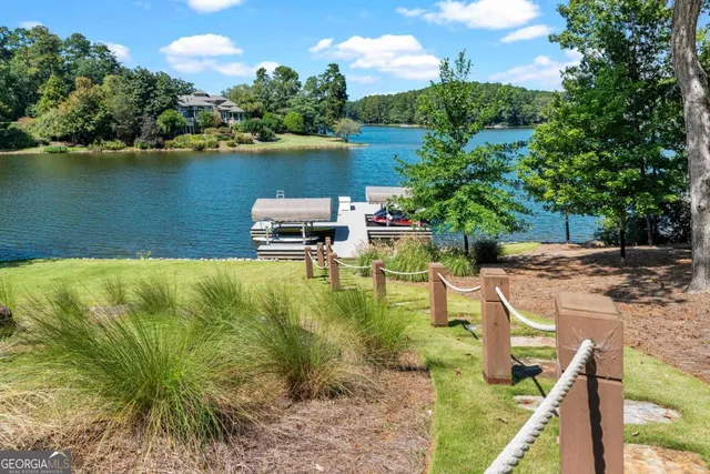 a view of a lake with a house in the background