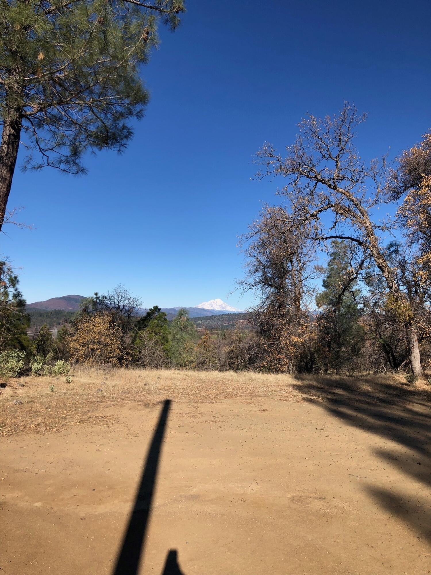 17759 Patterson Ranch Road Round Mountain, CA 96084 - Photo 22 of 24 a view of a yard covered with snow in front of house