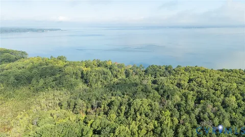 a view of a field with an ocean
