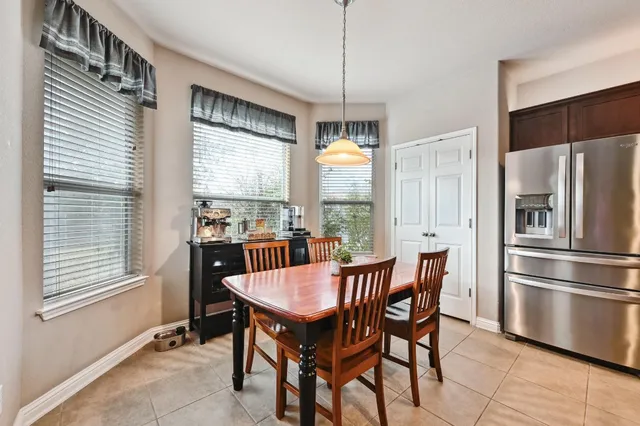 a view of a dining room with furniture window and outside view