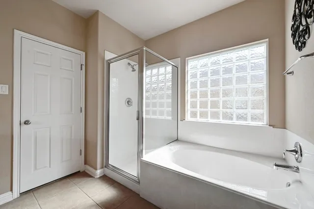 a bathroom with a bathtub and a sink
