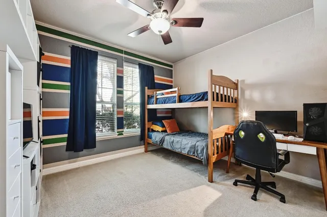 a bedroom with a workspace