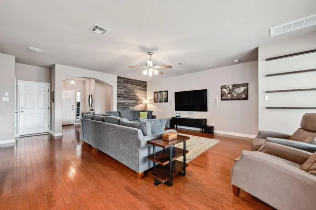 a living room with furniture and a flat screen tv