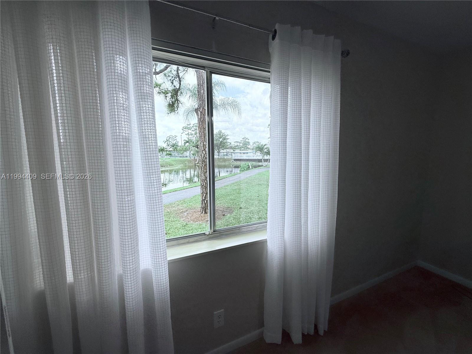 340 Pine Ridge Circle, Unit C1 Greenacres, FL 33463 - Photo 21 of 24 a view of a wooden door