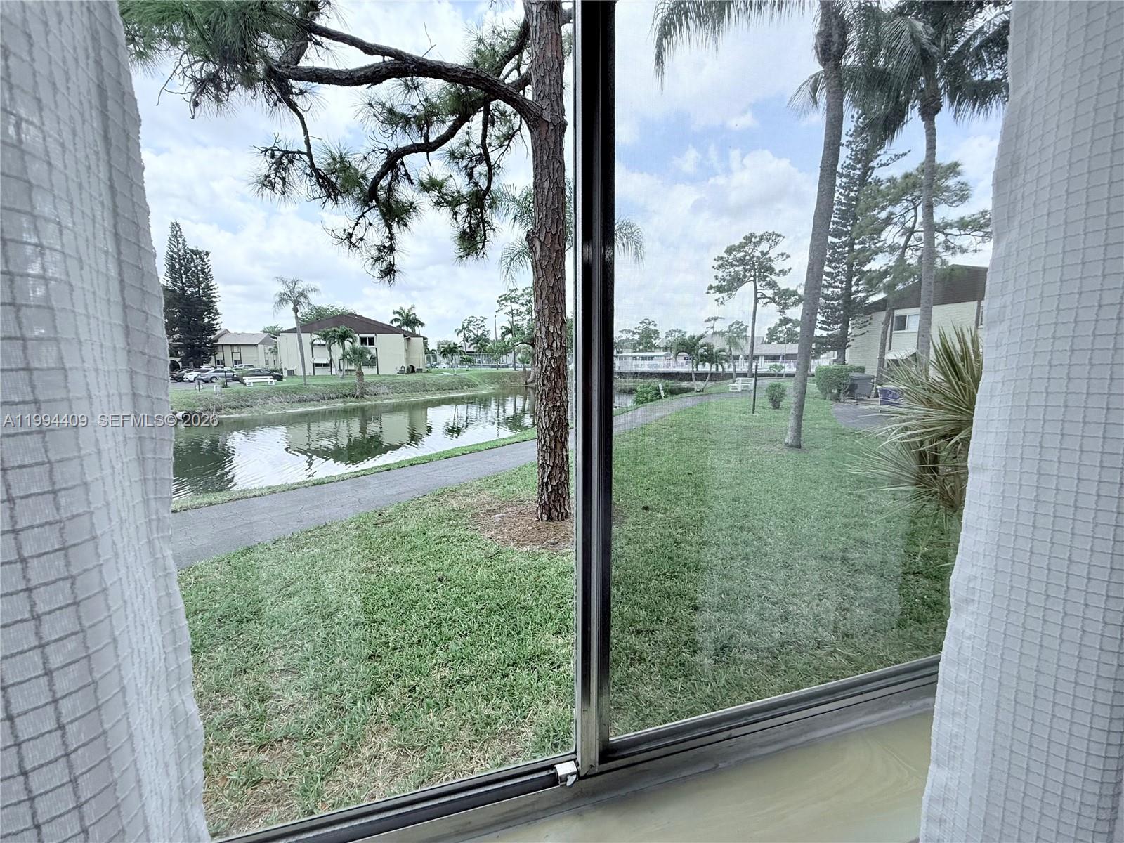 340 Pine Ridge Circle, Unit C1 Greenacres, FL 33463 - Photo 22 of 24 a view of outdoor from window