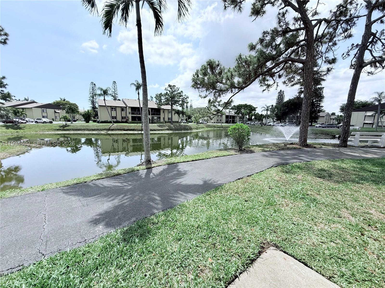 340 Pine Ridge Circle, Unit C1 Greenacres, FL 33463 - Photo 5 of 24 a view of lake