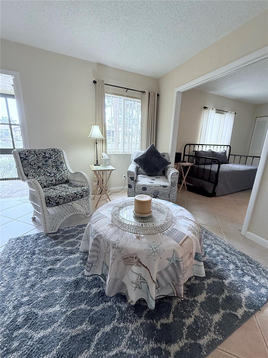 340 Pine Ridge Circle, Unit C1 Greenacres, FL 33463 - Photo 9 of 24 a living room with furniture and a couch