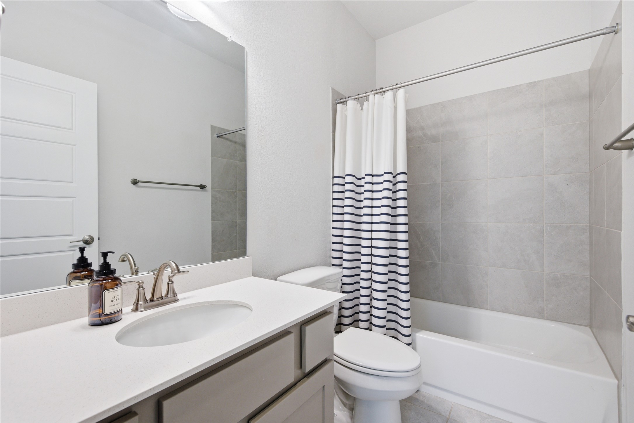 1300 Harwell Loop Kyle, TX 78640 - Photo 15 of 21 a bathroom with a sink toilet and shower