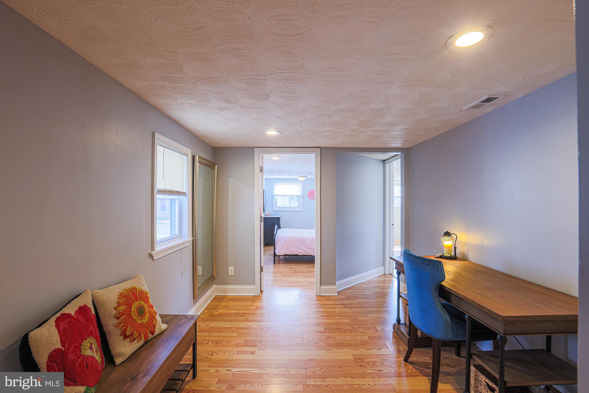 2519 Sycamore Avenue Baltimore, MD 21219 - Photo 11 of 30 a living room with furniture and a wooden floor