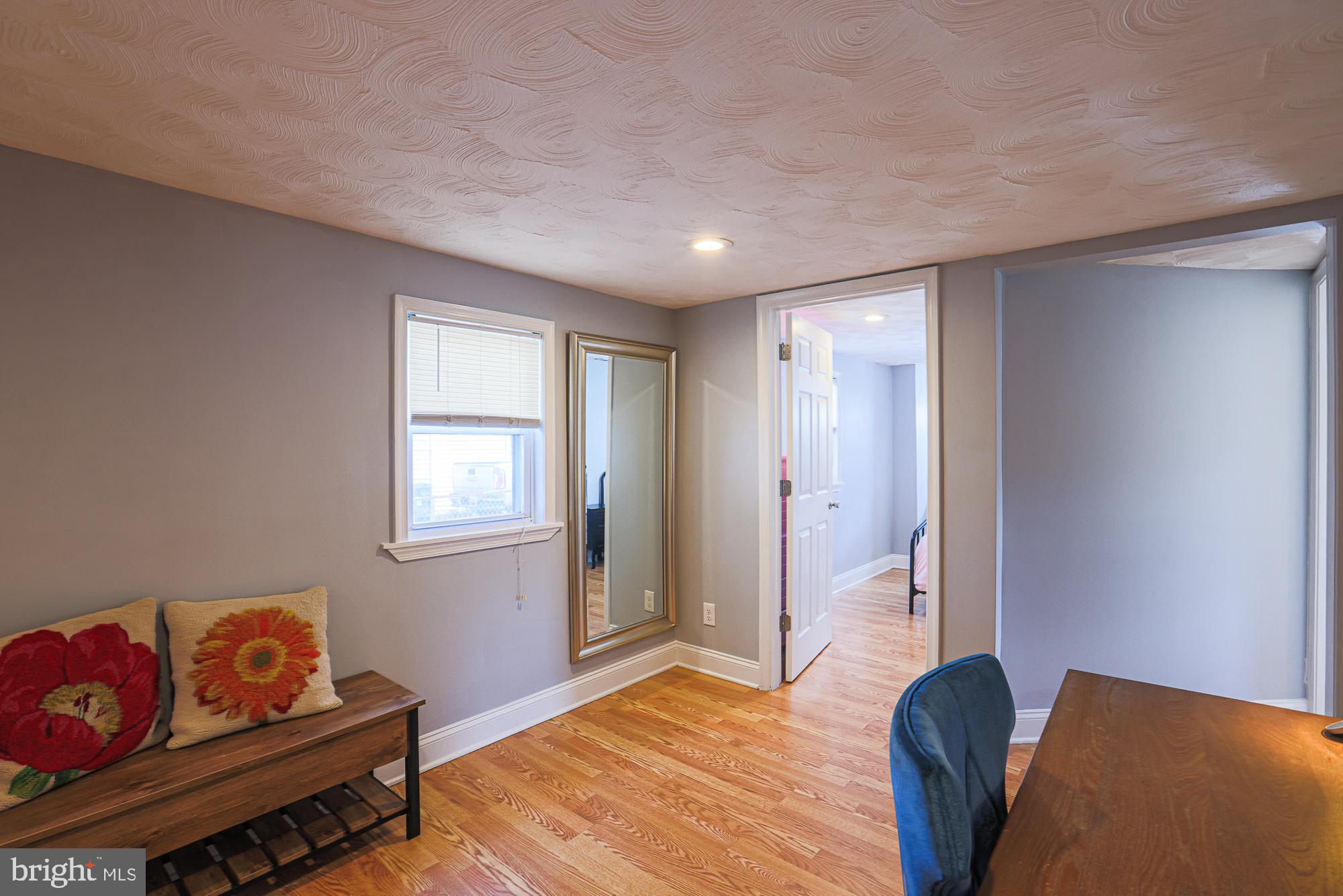 2519 Sycamore Avenue Baltimore, MD 21219 - Photo 12 of 30 a bedroom with furniture and a window