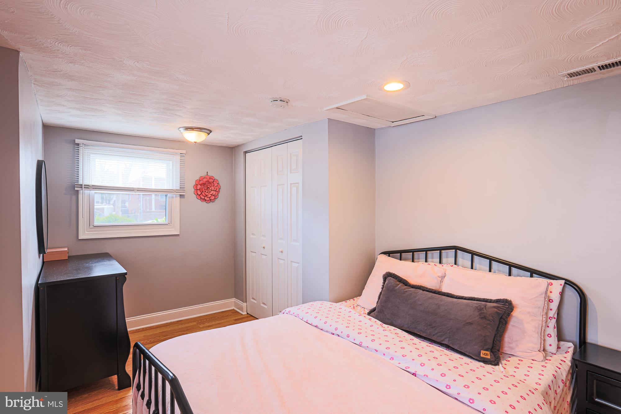 2519 Sycamore Avenue Baltimore, MD 21219 - Photo 19 of 30 a bedroom with a bed and window
