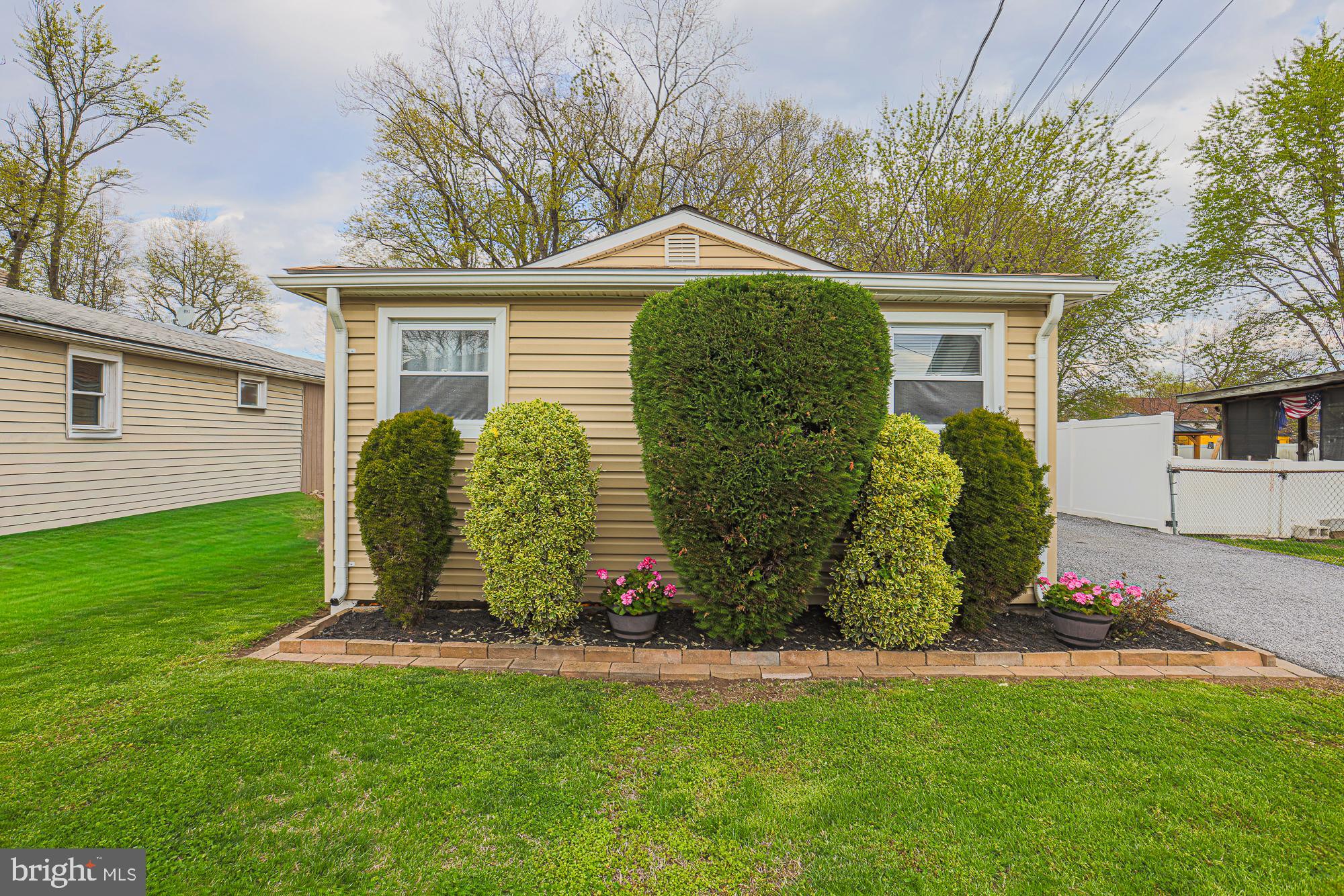 2519 Sycamore Avenue Baltimore, MD 21219 - Photo 2 of 30 a front view of a house with garden