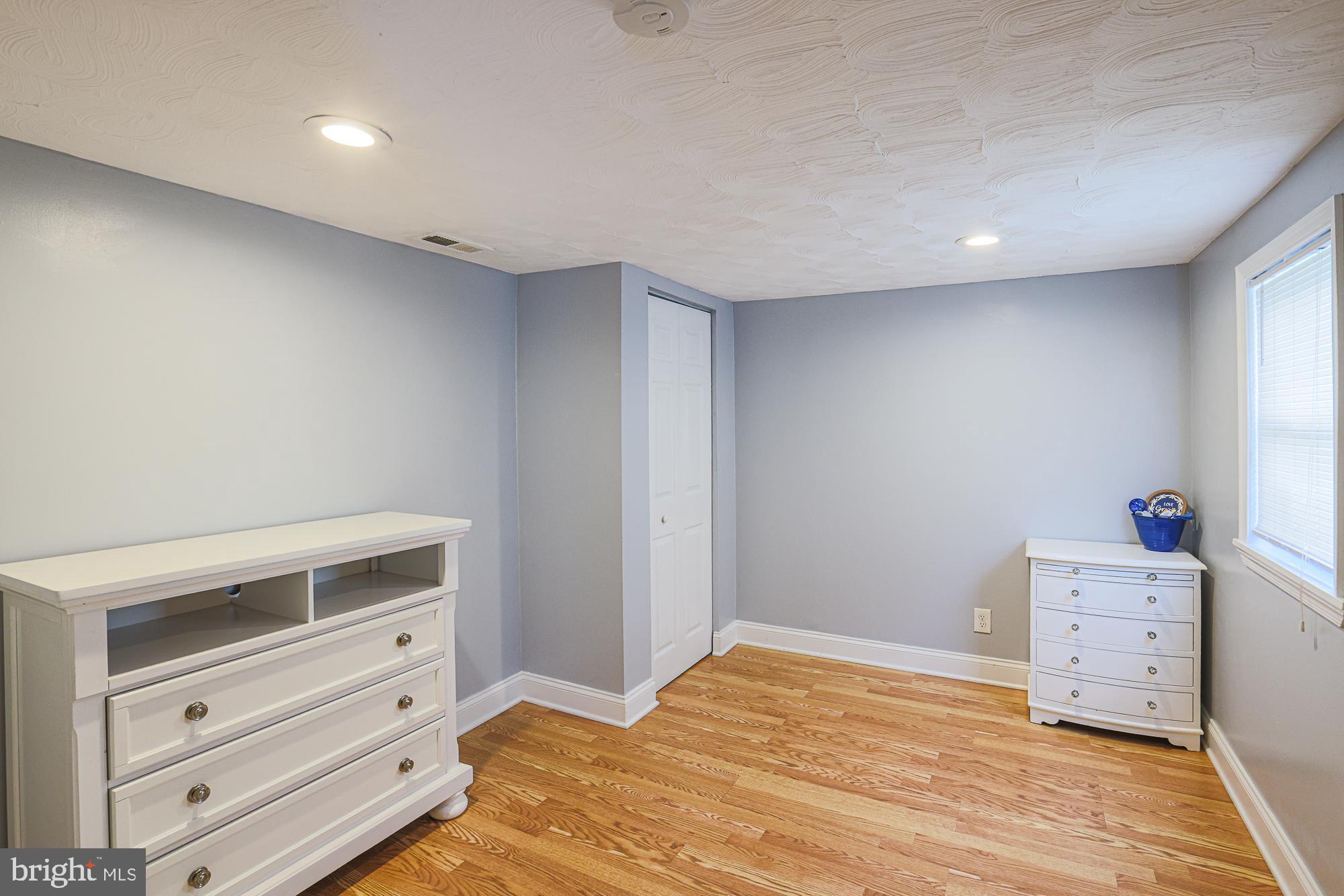 2519 Sycamore Avenue Baltimore, MD 21219 - Photo 21 of 30 a room with a dresser and pillows