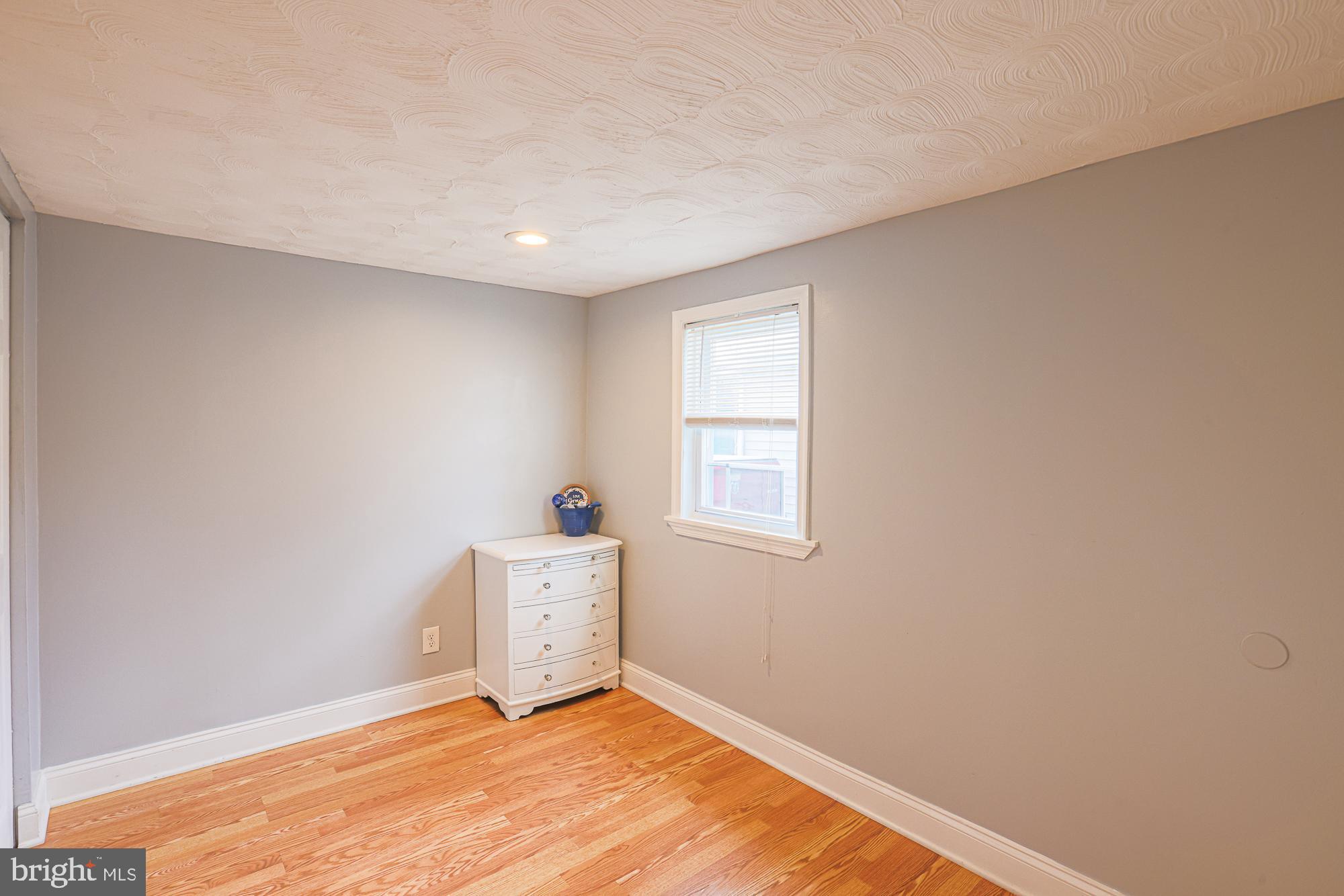 2519 Sycamore Avenue Baltimore, MD 21219 - Photo 22 of 30 a view of an empty room with a window