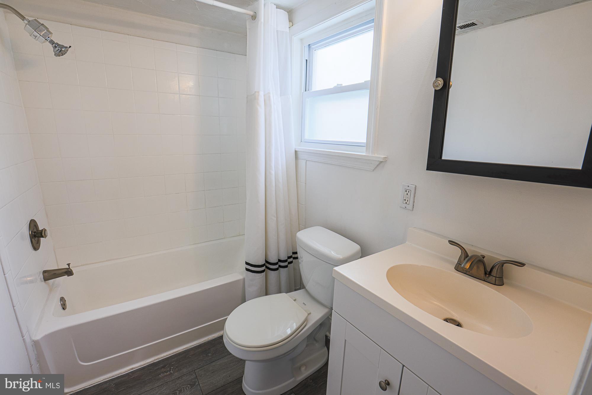 2519 Sycamore Avenue Baltimore, MD 21219 - Photo 23 of 30 a bathroom with a sink toilet and shower