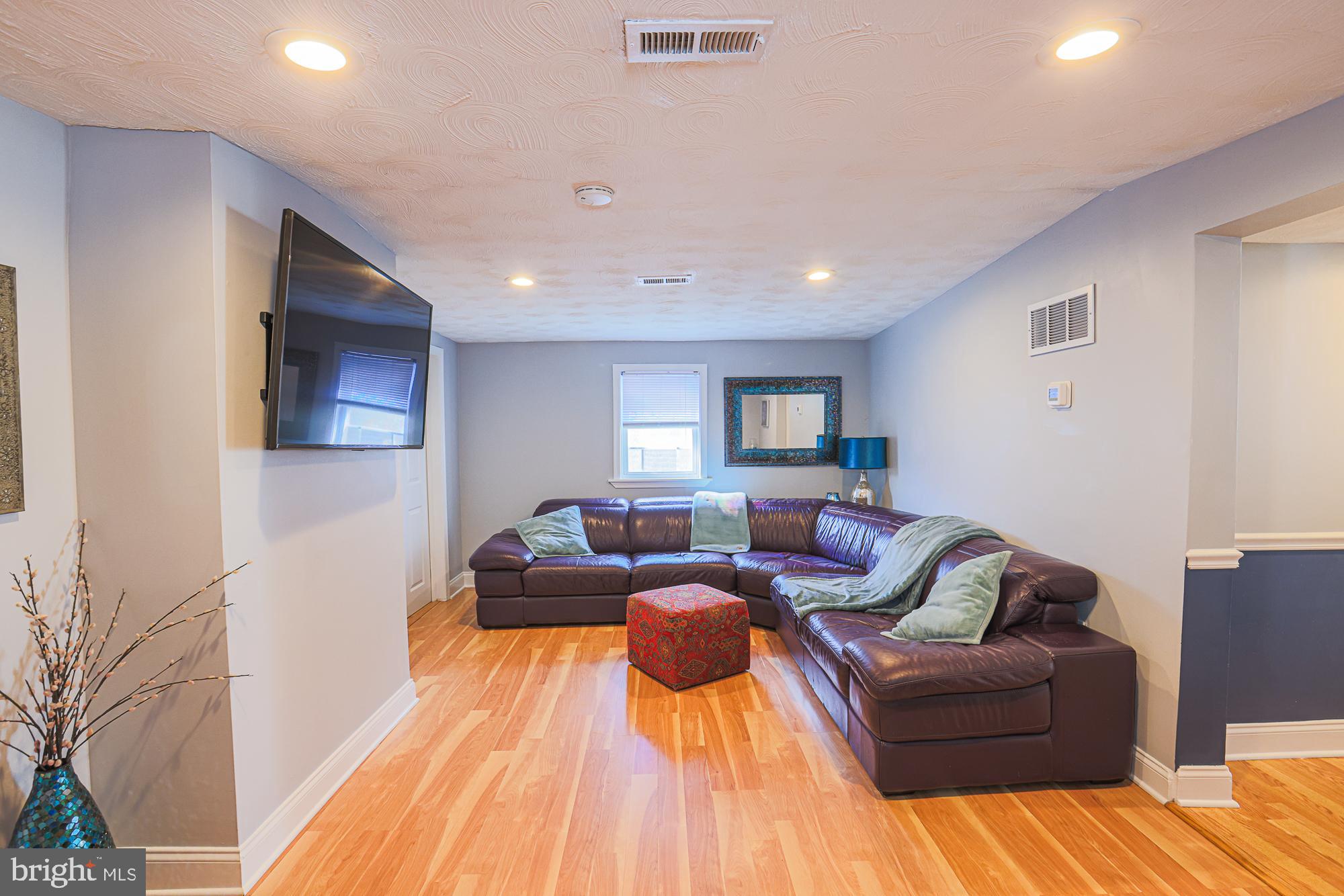 2519 Sycamore Avenue Baltimore, MD 21219 - Photo 4 of 30 a living room with furniture and a wooden floor