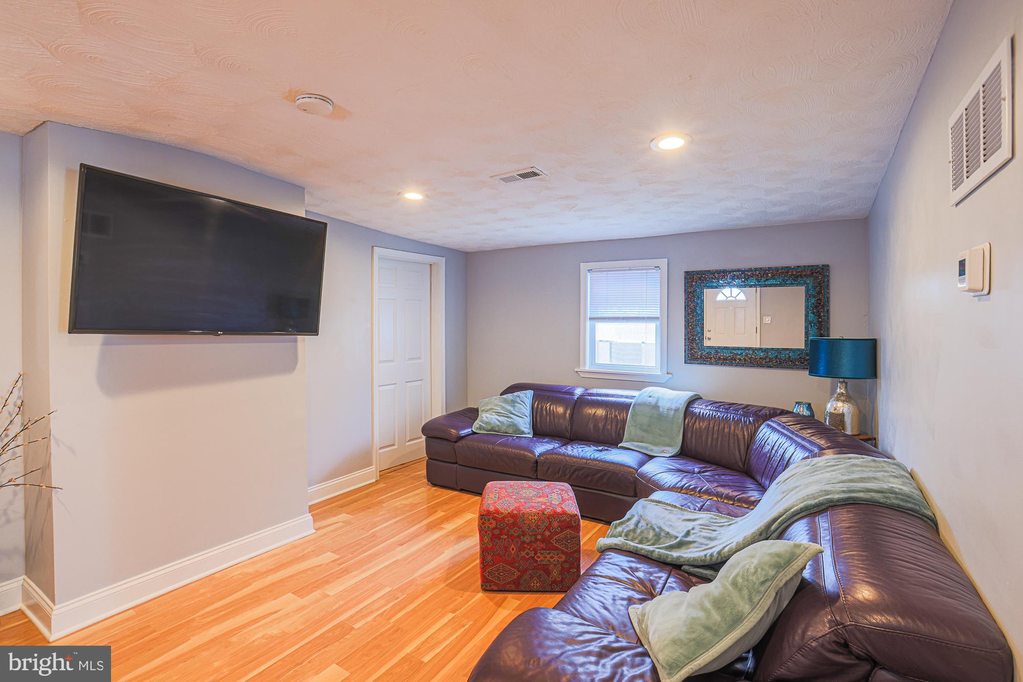 2519 Sycamore Avenue Baltimore, MD 21219 - Photo 5 of 30 a living room with furniture and a flat screen tv