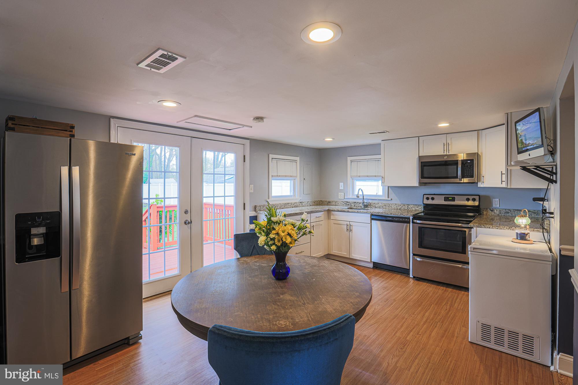 2519 Sycamore Avenue Baltimore, MD 21219 - Photo 6 of 30 a kitchen with stainless steel appliances granite countertop a refrigerator a stove top oven a sink and dishwasher