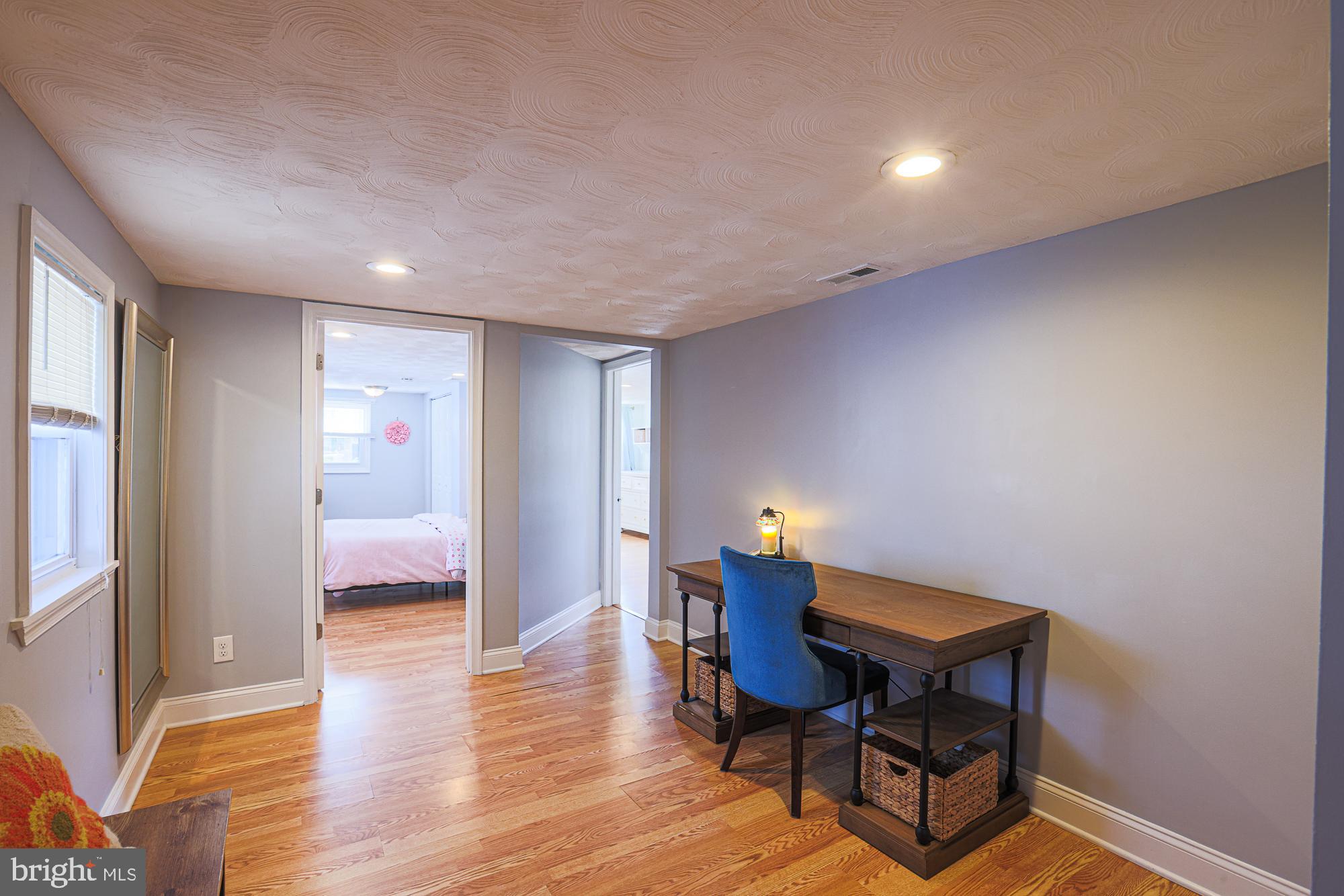 2519 Sycamore Avenue Baltimore, MD 21219 - Photo 10 of 30 a workspace with furniture and wooden floor