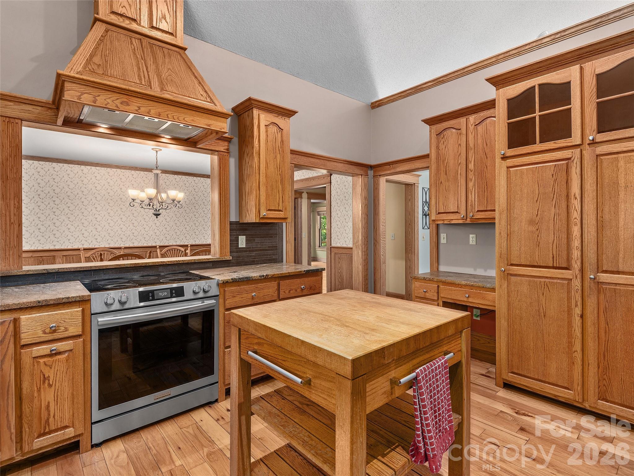 40 Deer Ridge Road Mills River, NC 28759 - Photo 8 of 35 a kitchen with a stove a refrigerator and a stove top oven