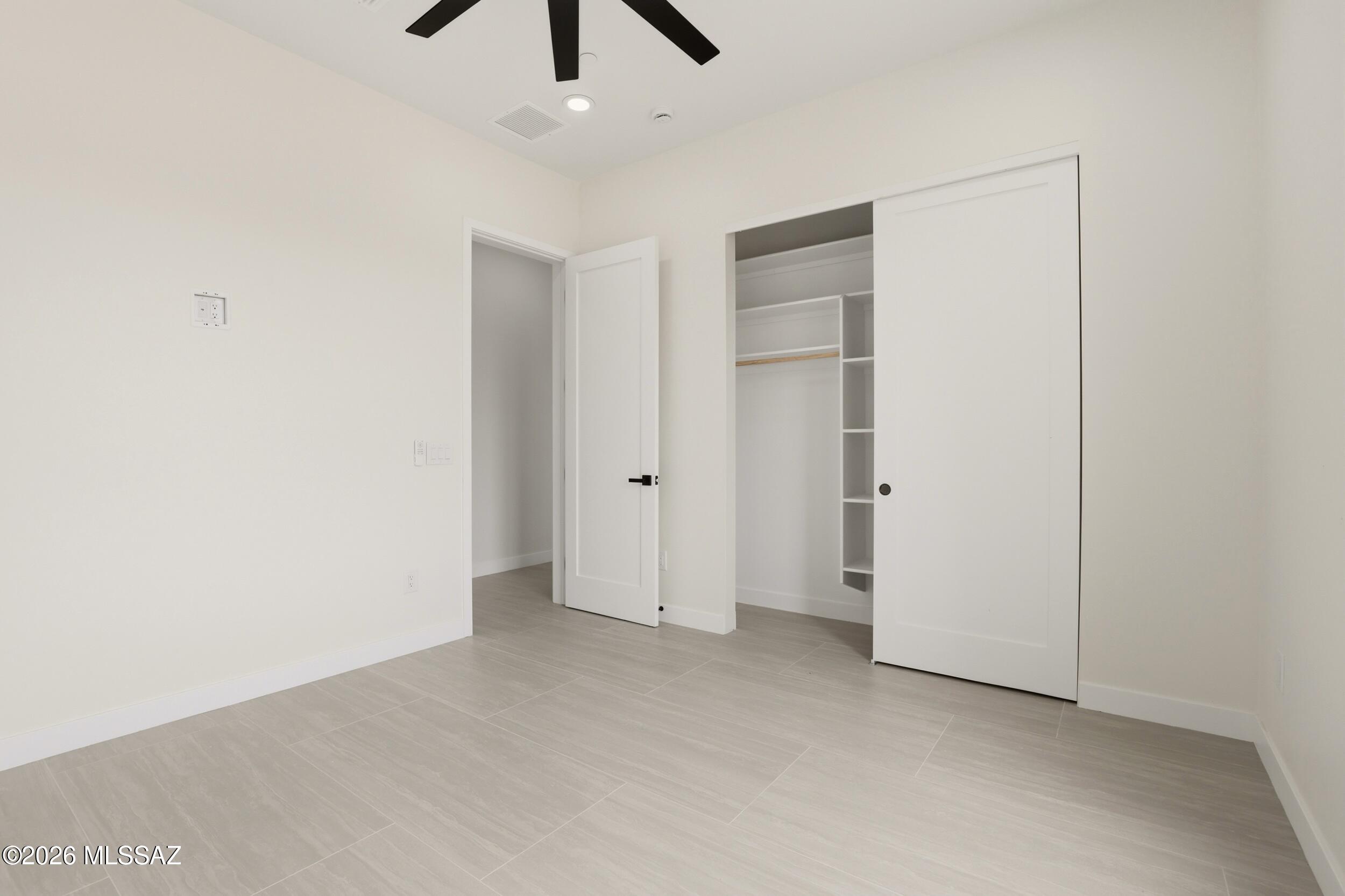 14527 East Sands Ranch Road Vail, AZ 85641 - Photo 30 of 48 an empty room with chandelier fan