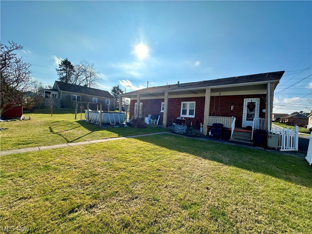 351 Rockdale Road Follansbee, WV 26037 - Photo 5 of 18 Back of house featuring a yard