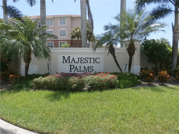 a sign that is sitting in front of flowers