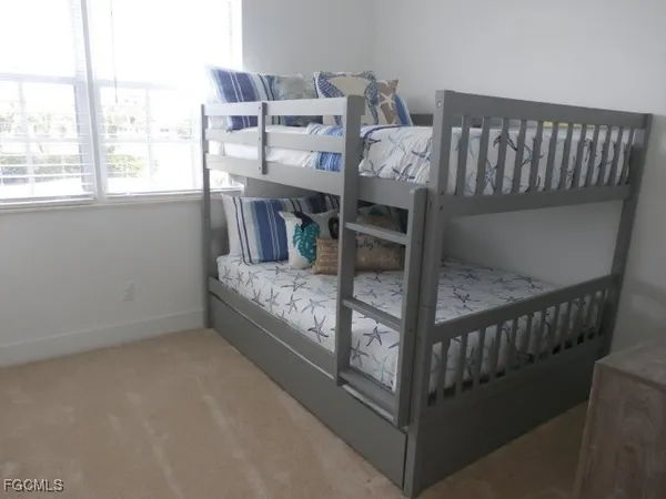 a view of a balcony with furniture