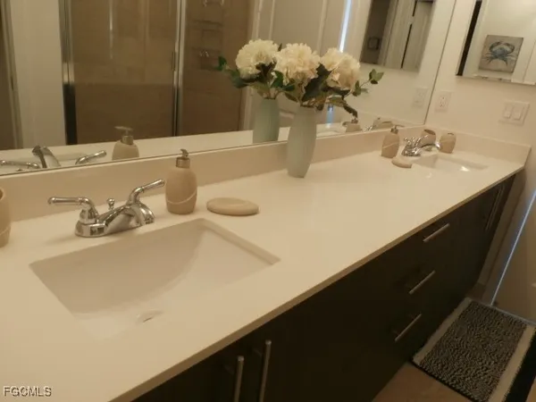 a bathroom with a sink and a mirror