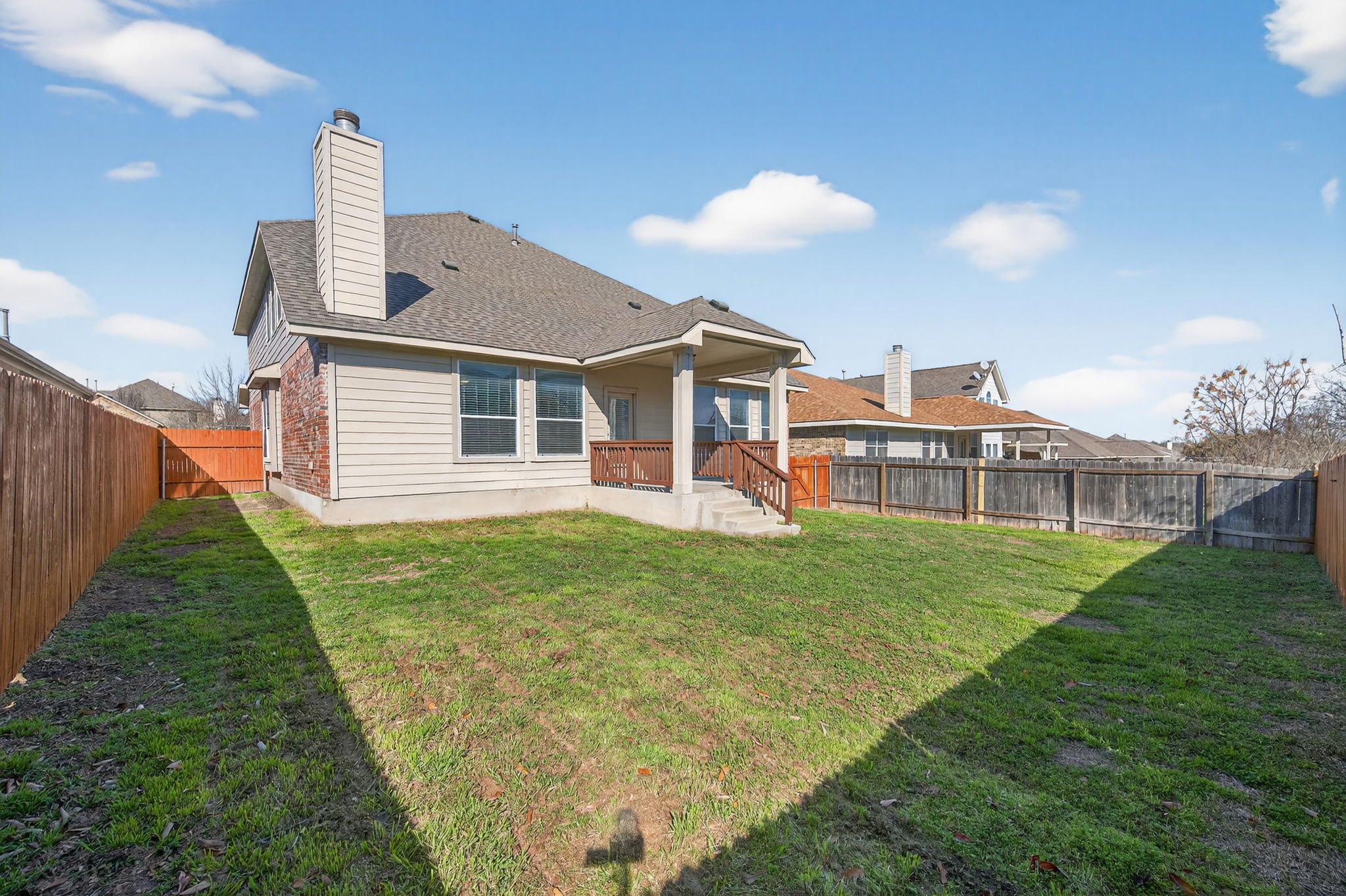 2305 Gavin Trail Pflugerville, TX 78660 - Photo 32 of 40 a view of a house with a backyard and porch