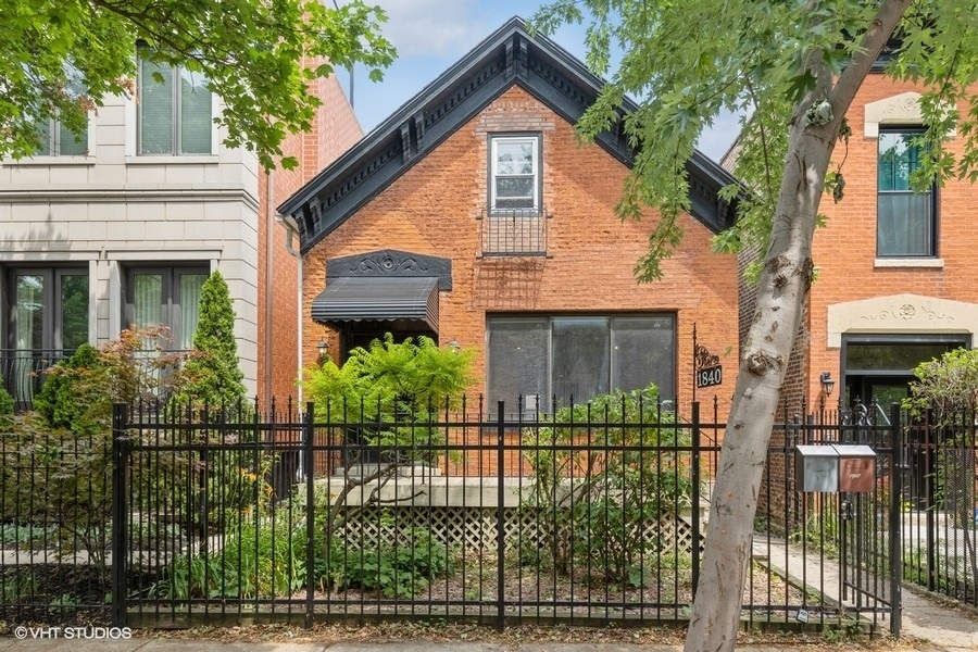1840 West Huron Street, Unit 1 Chicago, IL 60622 - Photo 1 of 16 a front view of a house with garden